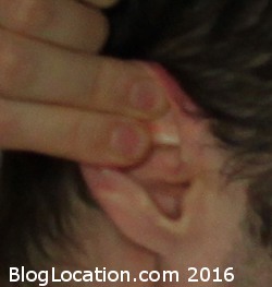 a0_inserting_foam_ear_plug_pull_ear_back_and_up_with_other_hand